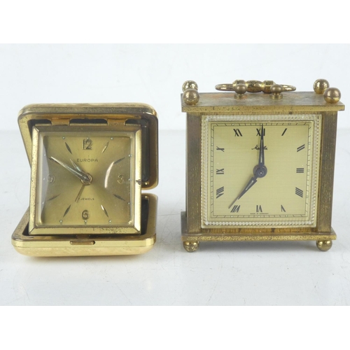 178 - A vintage Europa cased alarm clock and another miniature carriage clock.