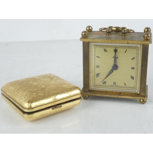 178 - A vintage Europa cased alarm clock and another miniature carriage clock.