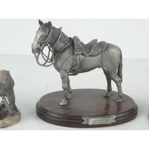 179 - 'J W Marshall' metal figure, measuring 11cm, a 'Sefton' metal figure of a horse, and another of an e... 