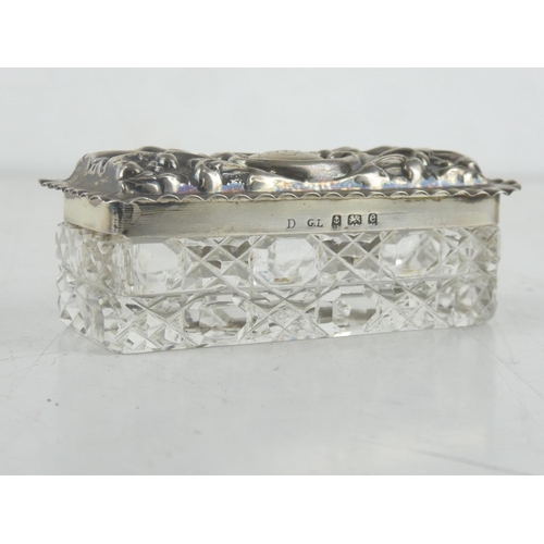 202 - An antique Sterling Silver lidded dressing table box.