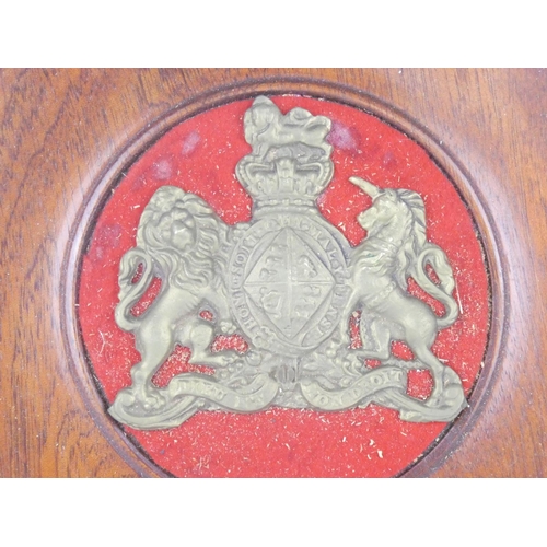 208 - A mahogany wall plaque with brass crest, measuring 9