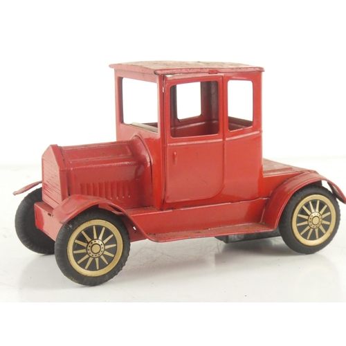 220 - A vintage tin plate clockwork toy car.