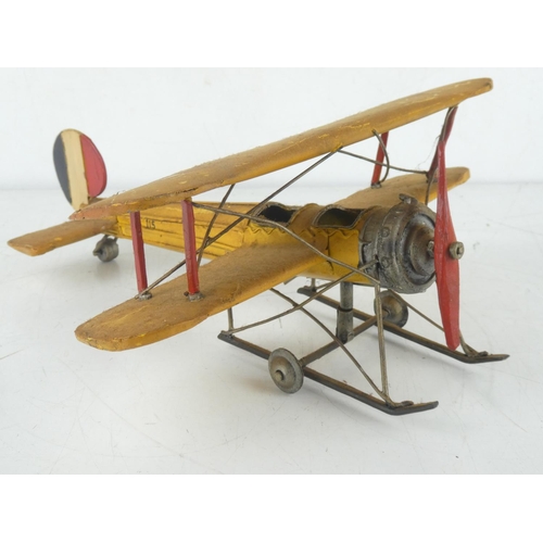 256 - A tin plate toy aeroplane.