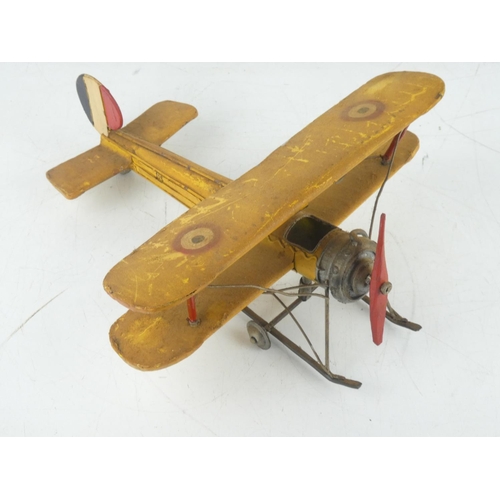 256 - A tin plate toy aeroplane.