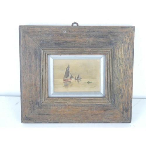 259 - A miniature framed painting of boats, unsigned, measuring including frame 19cm x 17cm.