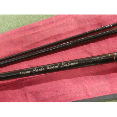 596 - A Daiwa graphite Carbo Regal Salmon three piece fishing rod and bag.