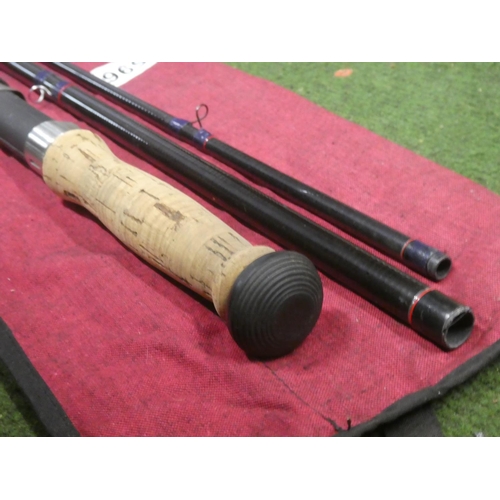 596 - A Daiwa graphite Carbo Regal Salmon three piece fishing rod and bag.