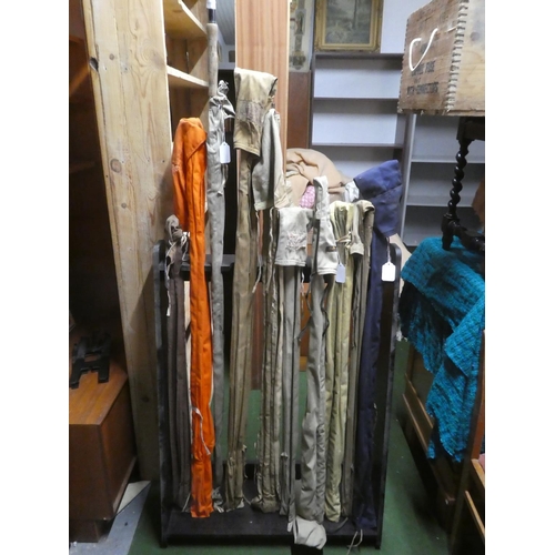 600 - A large collection of vintage cane fishing rods to include Wardop of Cumnock three piece cane rod an... 