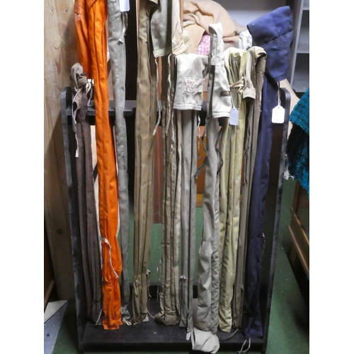 600 - A large collection of vintage cane fishing rods to include Wardop of Cumnock three piece cane rod an... 