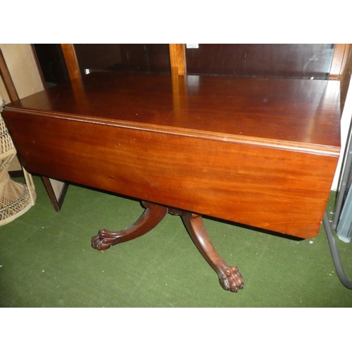 602 - A mahogany square topped dining room table on a carved ball and claw tripod base.