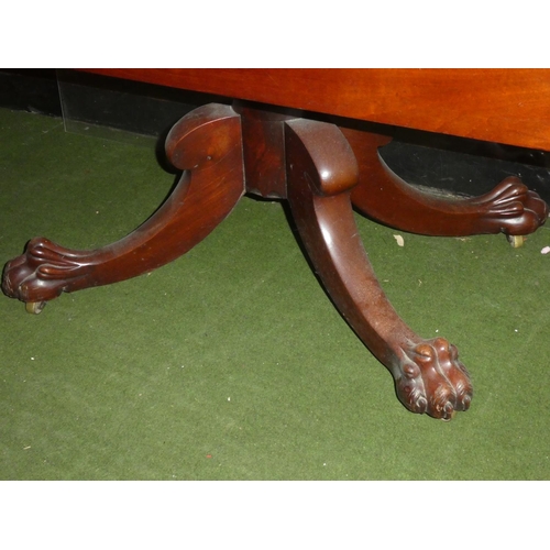 602 - A mahogany square topped dining room table on a carved ball and claw tripod base.