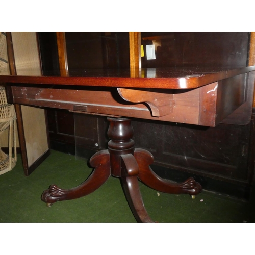 602 - A mahogany square topped dining room table on a carved ball and claw tripod base.