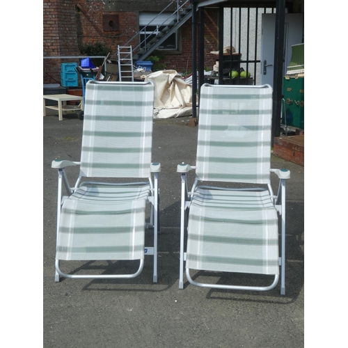 614 - A pair of Outwell garden loungers.