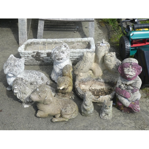 622 - A large lot of concrete garden ornaments and planter.