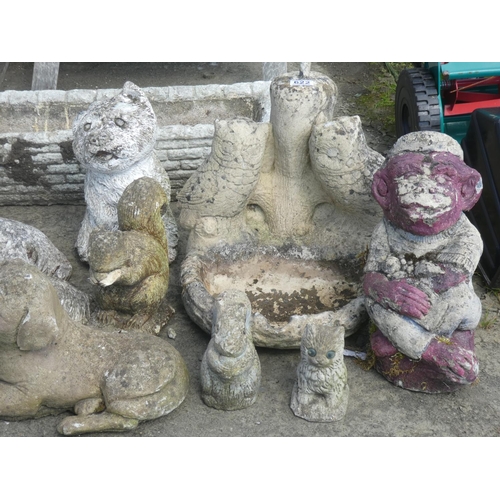 622 - A large lot of concrete garden ornaments and planter.