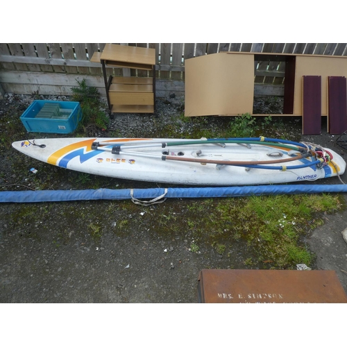 627 - A Star Panther wind surfing board and sail.