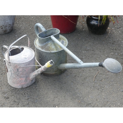 631 - Two vintage watering cans.