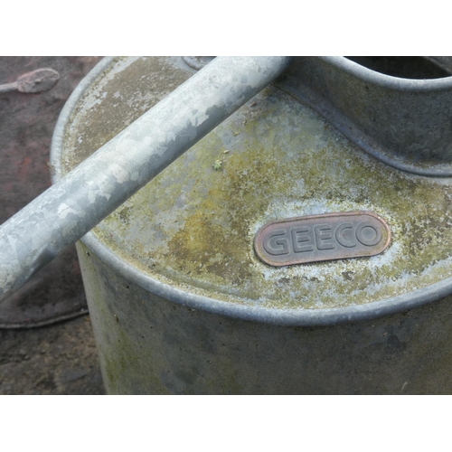 631 - Two vintage watering cans.