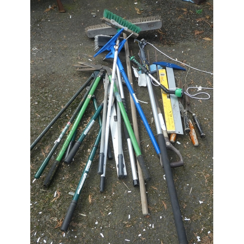 651 - A lot of assorted brushes, garden edger's and more.