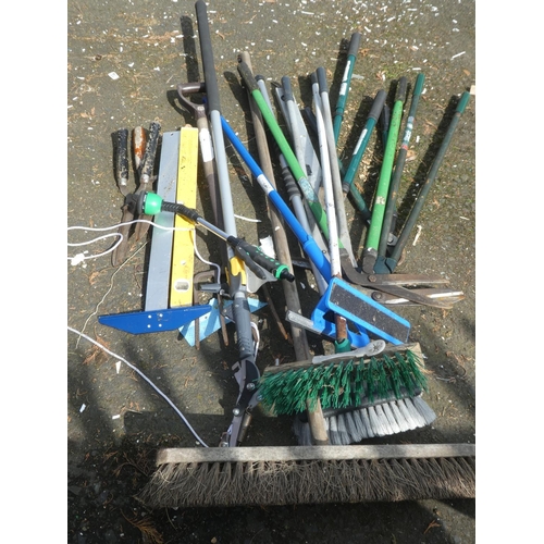 651 - A lot of assorted brushes, garden edger's and more.