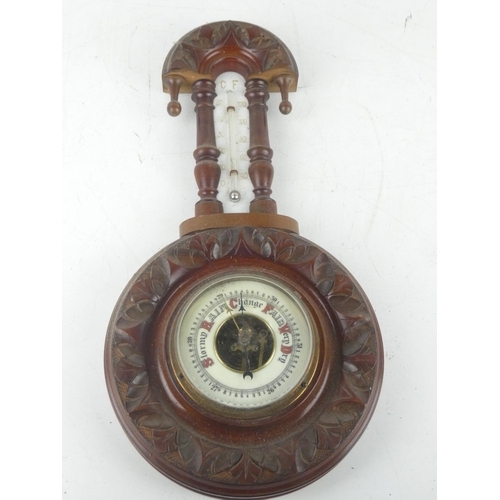 257 - An antique mahogany barometer with carved detail and porcelain dial, measuring 14