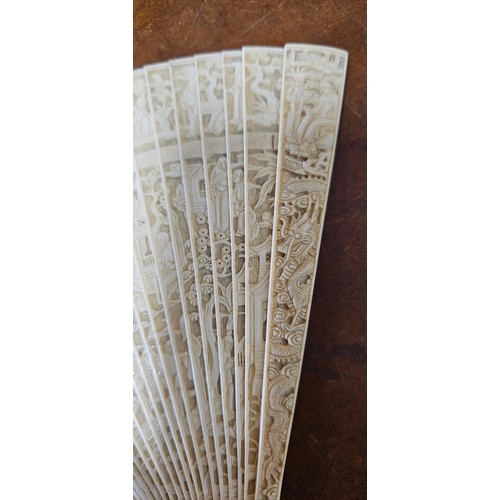 638 - A stunning Mid 19th Century Cantonese Brise hand fan, with decoratively carved bone segments (missin... 