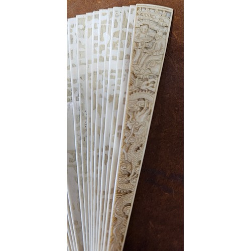 638 - A stunning Mid 19th Century Cantonese Brise hand fan, with decoratively carved bone segments (missin... 