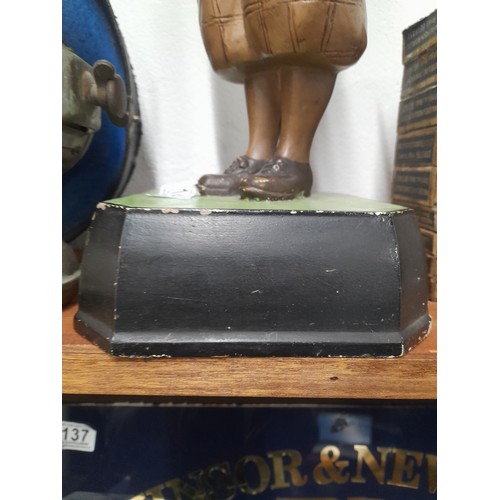 145 - A rare Bromford Man advertising golfing figure complete with pipe and mounted on original square bas... 