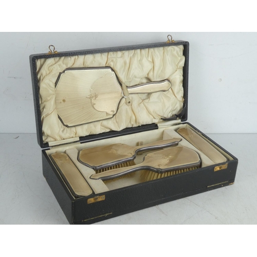 100 - A stunning antique Sterling Silver five piece dressing table set in its presentation box and also in... 