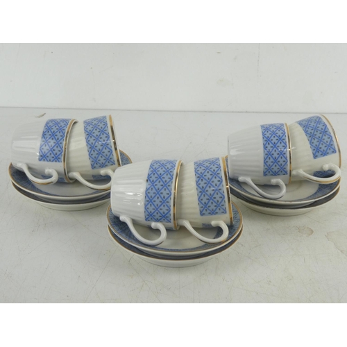 14 - A six piece setting coffee set with blue patterned design and gilt trim and a Goebel figure 'Greta' ... 