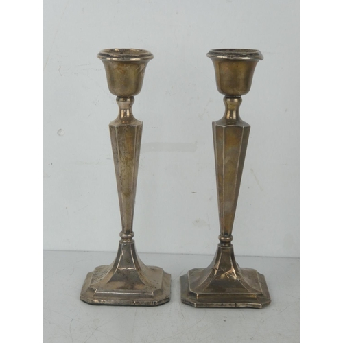 28 - A pair of Sterling silver candlesticks, weighing 454.5 grams, 23cm tall.