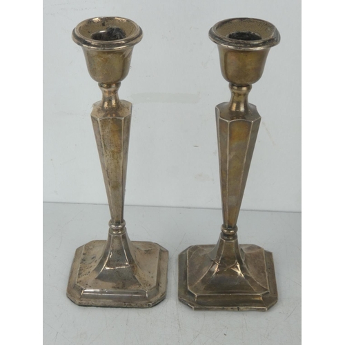 28 - A pair of Sterling silver candlesticks, weighing 454.5 grams, 23cm tall.