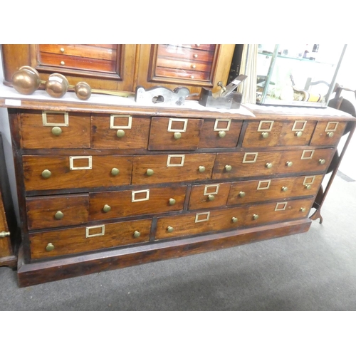 32 - An antique style Apothecary//haberdashery bank of 19 drawers.