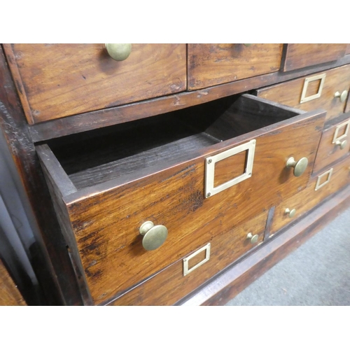 32 - An antique style Apothecary//haberdashery bank of 19 drawers.