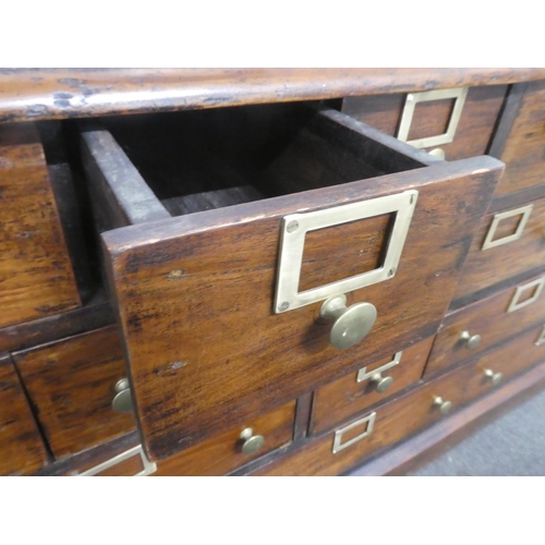 32 - An antique style Apothecary//haberdashery bank of 19 drawers.