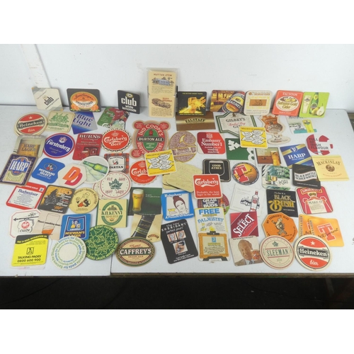 42 - A lot of vintage coasters/beer mats to include William Younger's Ales, Tennent's, Heineken, Black Bu... 