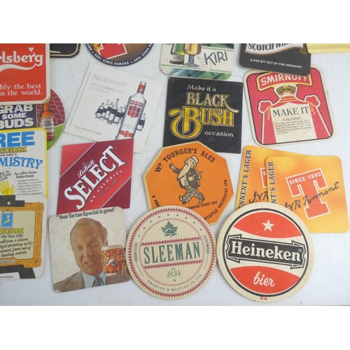 42 - A lot of vintage coasters/beer mats to include William Younger's Ales, Tennent's, Heineken, Black Bu... 