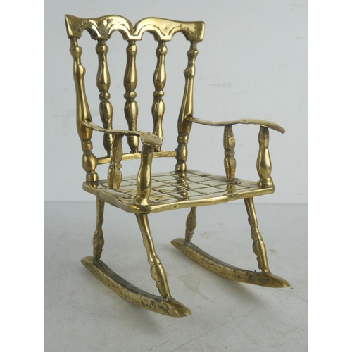 44 - A large vintage brass rocking chair.