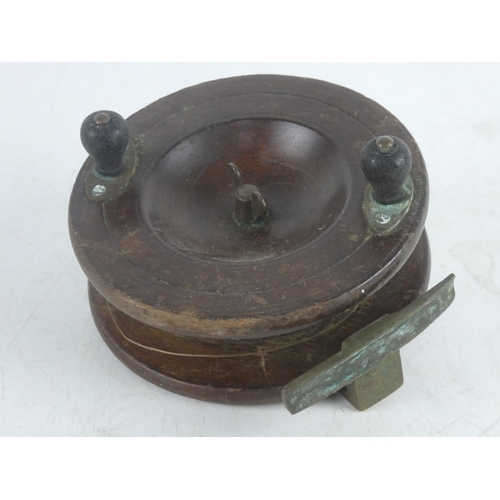 48 - A large vintage wooden fishing reel.