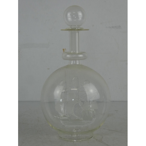 50 - A glass ship in a glass decanter.