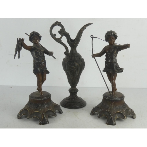 54 - A pair of vintage spelter figures and similar decorative ewer.