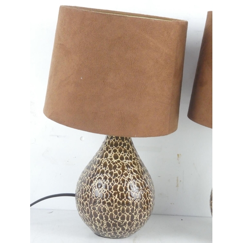 62 - A pair of ceramic table lamps and shades.