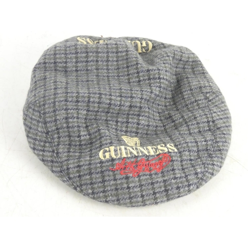 82 - A Guinness tartan cap.