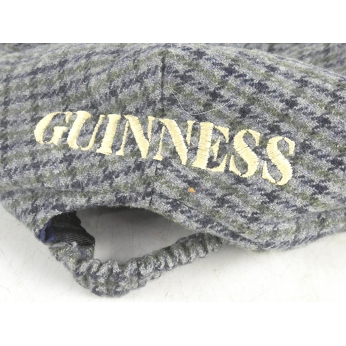 82 - A Guinness tartan cap.