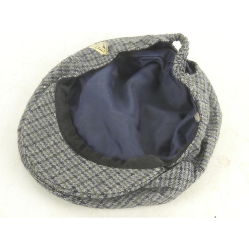 82 - A Guinness tartan cap.