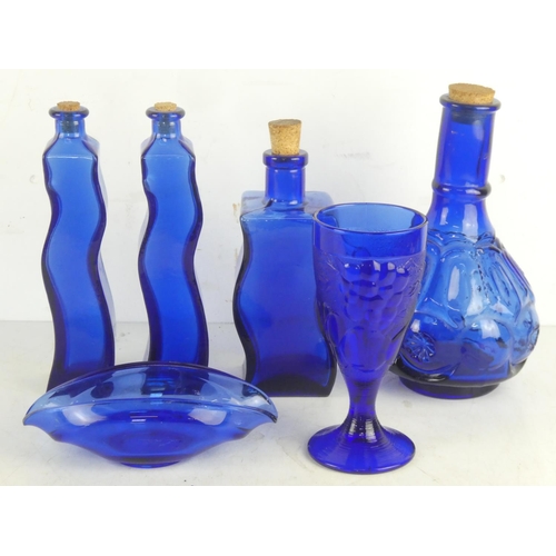 84 - A collection of blue glass ware.