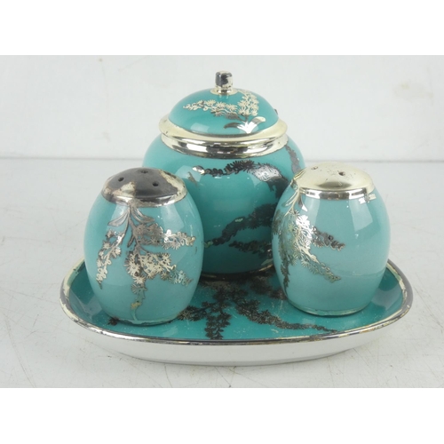 9 - A vintage Silberporzellan pottery condiment set.