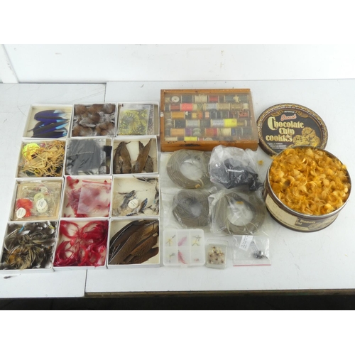 92 - A mixed lot of fly fishing/tying material to include a wooden box of assorted tinsel spools thread a... 