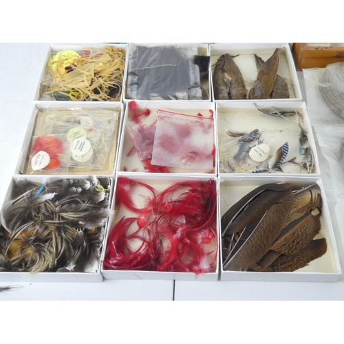 92 - A mixed lot of fly fishing/tying material to include a wooden box of assorted tinsel spools thread a... 