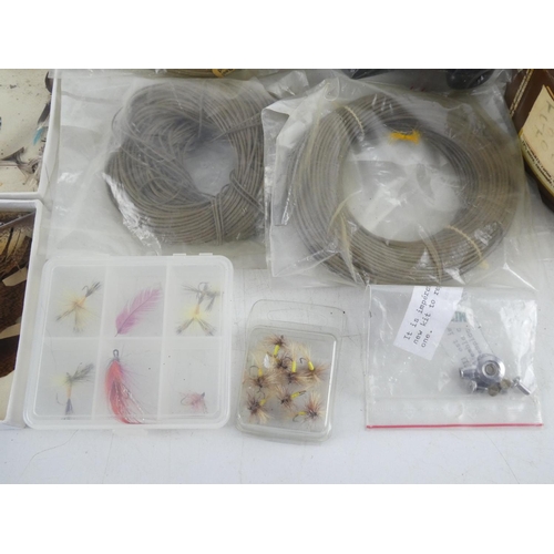 92 - A mixed lot of fly fishing/tying material to include a wooden box of assorted tinsel spools thread a... 